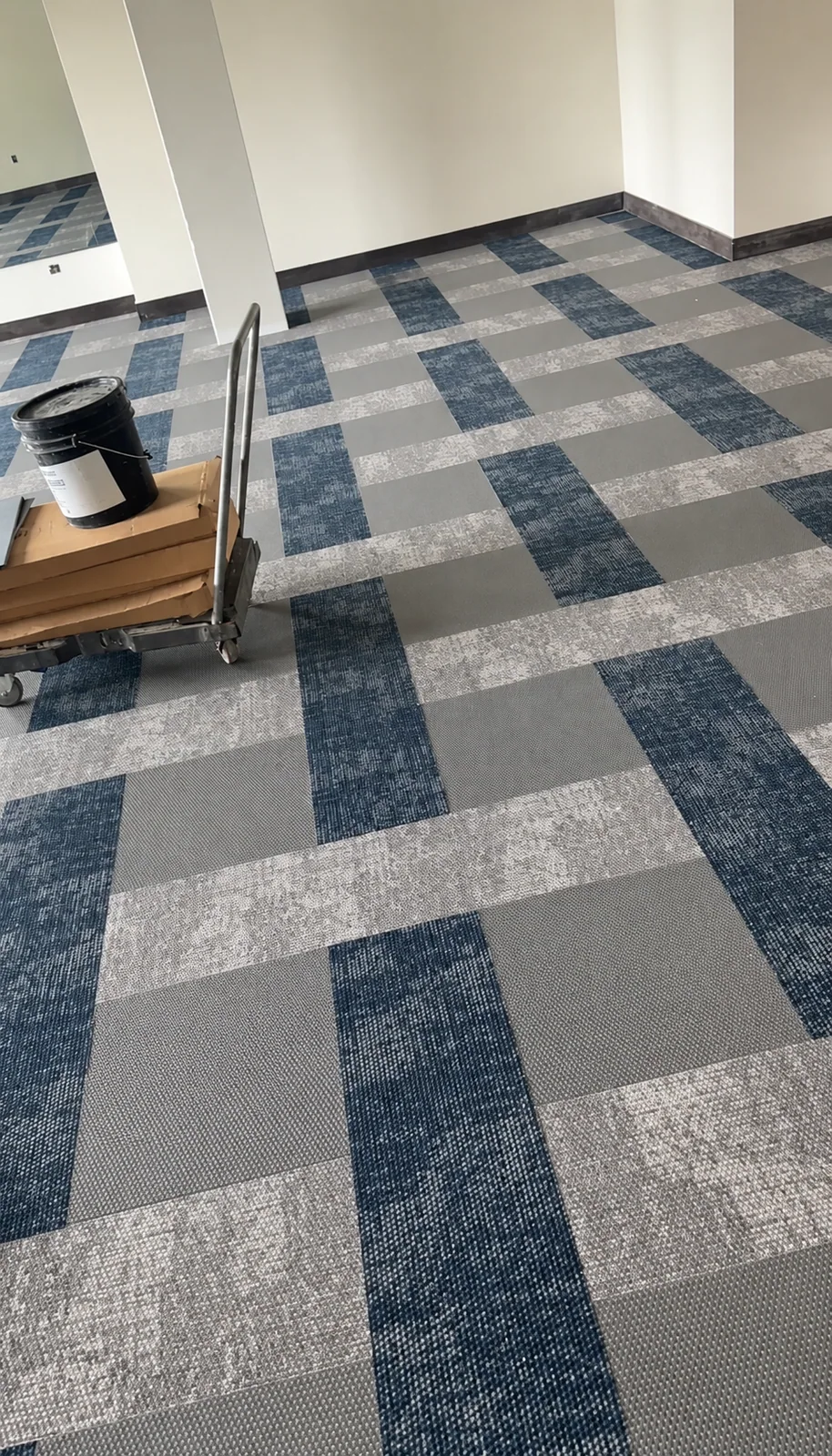 Patterned carpet tile across a room floor
