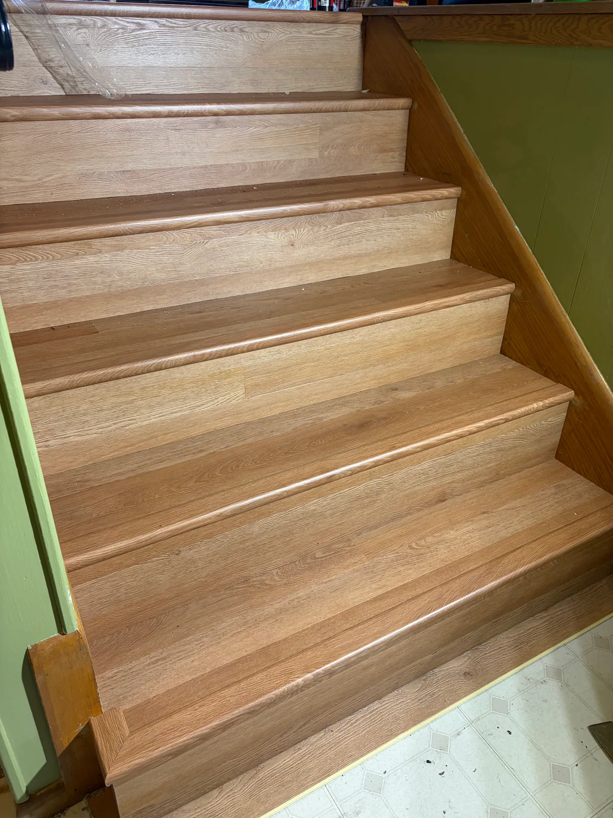 Close view of wood-tone stair treads and risers